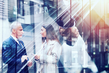 Wall Mural - Handshaking business person in office. concept of teamwork and partnership. Double exposure