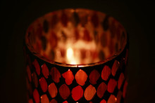The Fire In The Candle Holder With Colored Glass
