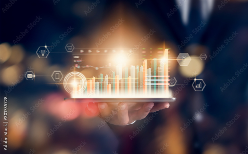 Stock exchange market concept, hand trader holding tablet with graphs analysis candle line on bokeh colors light in night. - obrazy, fototapety, plakaty 