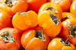 © Nitr - fresh ripe persimmon fruit as background