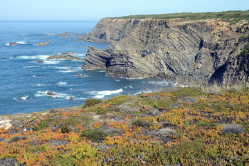 Wall Mural - Dramatic and colorful cliffs on Alentejo West Coast at Cabo Sardao, Alentejo, Portugal