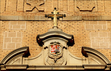 The Sign Of The Cross And And Figures Above The Door Of A Old Historical Buildings In Toledo Spain, Stone Brick Wall