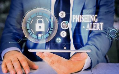 Poster - writing note showing phishing alert. business concept for aware to fraudulent attempt to obtain sens