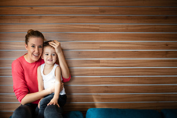 Wall Mural -  Mom and son. Happy mother's day! Mother hugging her child.  The kind of love that can't be described, only felt. Affectionate mother and son having fun. Son in a tender embrace of mother