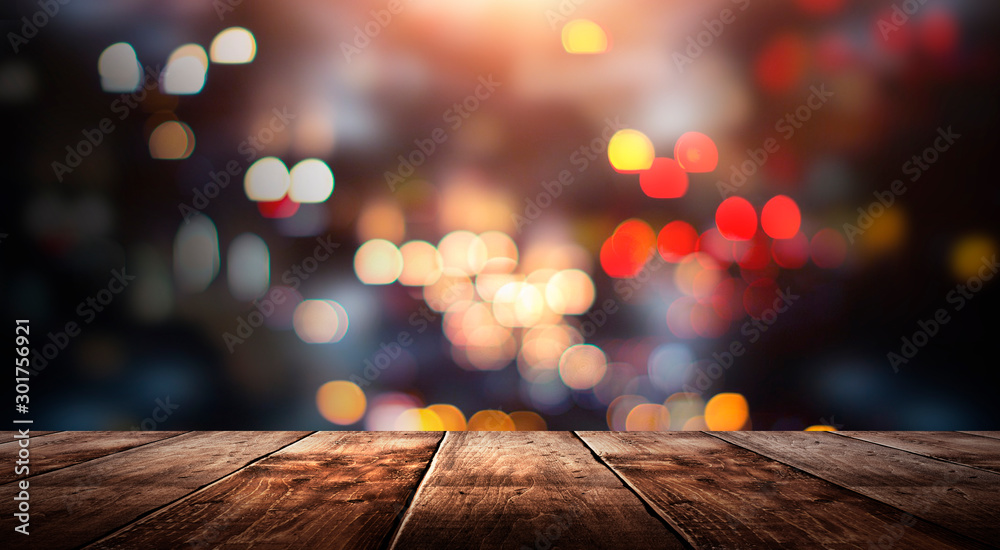 Wooden table, blurred bokeh background background. Neon light, night view, close-up. The general background of the interior, a dark background. - obrazy, fototapety, plakaty 