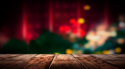 Wall Mural - Wooden table, blurred bokeh background background. Neon light, night view, close-up. The general background of the interior, a dark background.