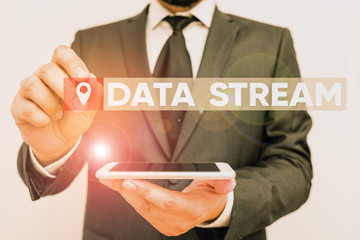 Poster - Conceptual hand writing showing Data Stream. Concept meaning sequence of digitally encoded coherent signals used to transmit Male human wear formal work suit hold smartphone using hand