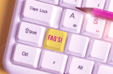 Conceptual hand writing showing Faq S. Concept meaning list of questions and answers relating to particular subject White pc keyboard with note paper above the white background