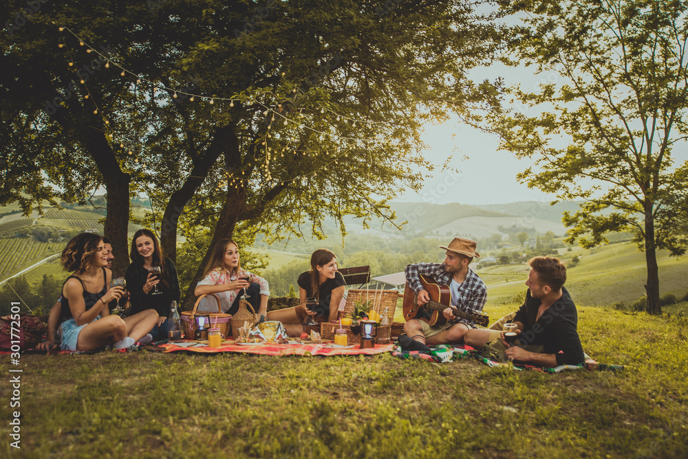 Group of friends eating in the nature - obrazy, fototapety, plakaty 