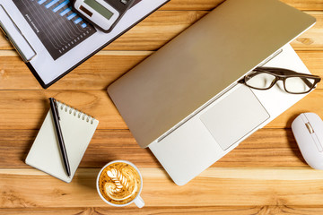 Wall Mural - Office desk table of modern workplace with laptop on wooden table, top view laptop background and copy space on wooden background,Flay lay, Top view office table desk with computer laptop,