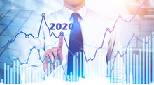 Businessman Working With 2020 Graph