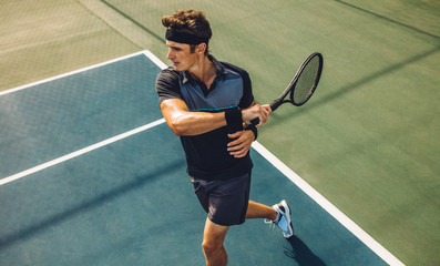 Tennis player practicing forehands