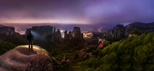 Wall Mural - night hike in greek meteora mountains - overlooking castle-like monasteries