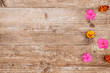 Marigolds and balsam on a wooden background.