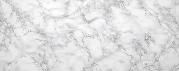 Marble background.White stone texture with gray shadow.Panoramic format.