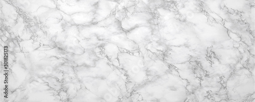 Marble background.White stone texture with gray shadow.Panoramic format.