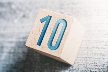 Poster - Number 10 On A Wooden Block On A Table