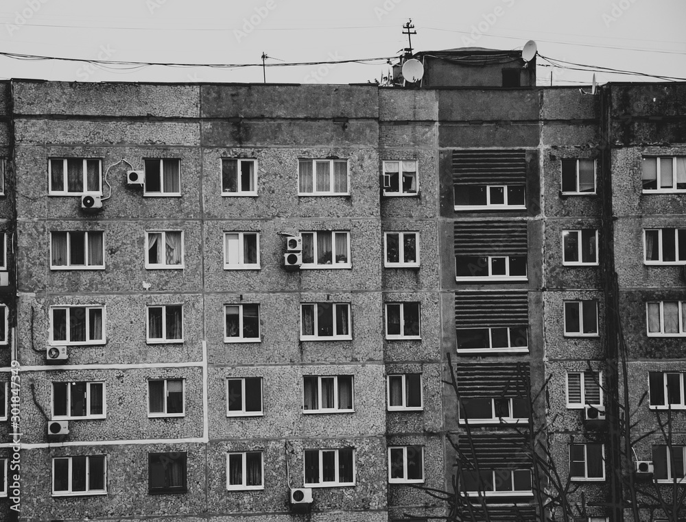 Multi-storey panel house, old. Houses of the USSR, roof, stairs ...