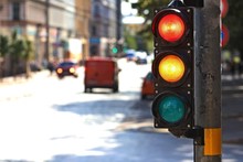  Traffic Light  On The Crossroad. Red And Yellow Light