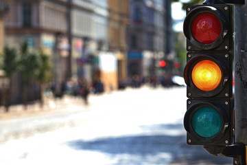  Traffic light  on the crossroad. Yellow light.