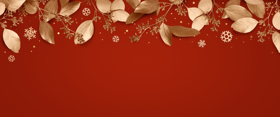 Wall Mural - red christmas holiday background. copy space for text with a garland of golden leaves and snowflakes