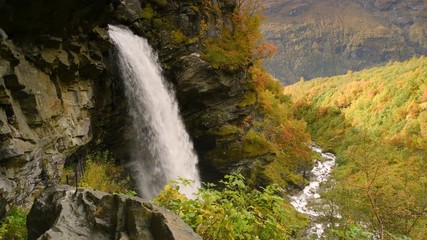 Wall Mural - Beautiful autumn landscape with yellow trees and waterfall