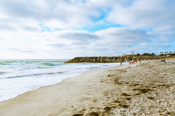 San Diego beach at sunset. Beautiful cloudy sky background