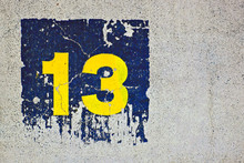 Number 13, Thirteen, Lucky Or Unlucky Number, Yellow And Blue On Plain Background.
