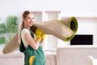 © Elnur - Professional female cleaner cleaning carpet