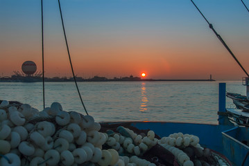 Poster - Istanbul, Turkey, 4 January 2012: Fishing Boat, ballon and Sunset at Kadikoy district