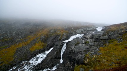 Wall Mural - Waterfall in autumn Norway mountains