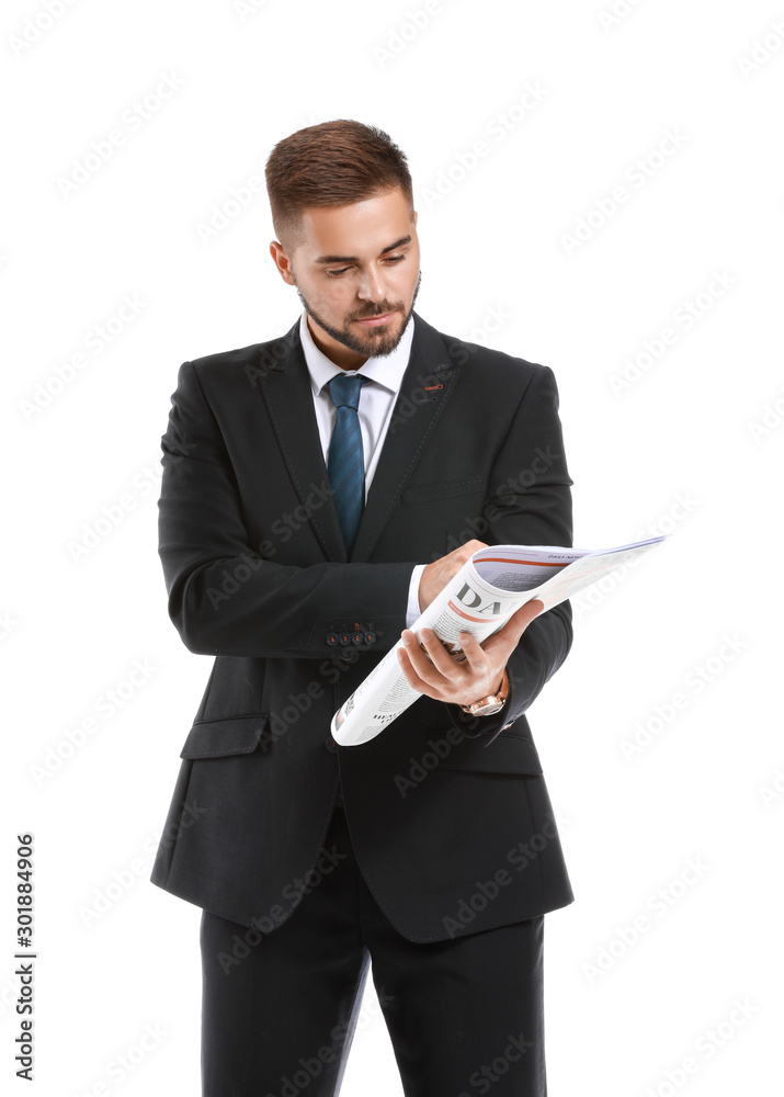 Handsome businessman with newspaper on white background