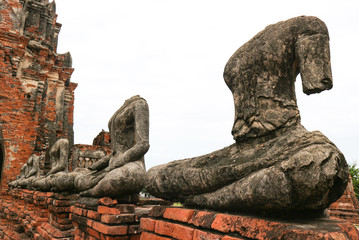 Tourist famous destination place, ruins of ancient buddha statue and Architecture at Wat Chaiwatthanaram in Ayutthaya Historical Park.