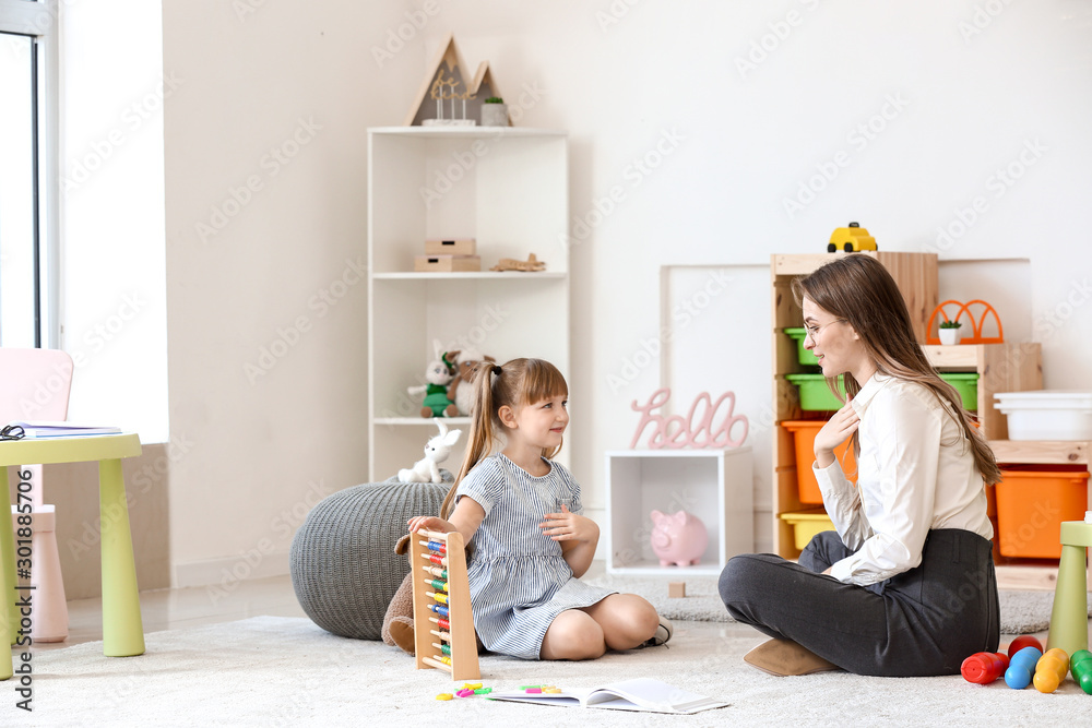 Cute little girl at speech therapist office