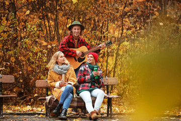 Canvas Print - Friends resting in autumn park