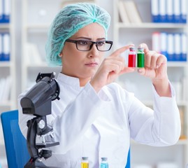 Female scientist researcher conducting an experiment in a labora