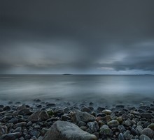 Beach During The Sunset Of Unique Colors Under The Gloomy Sky In Lofoten, Norway
