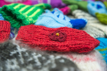 Background from wool products. Socks, mittens.