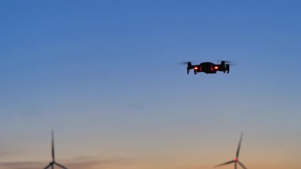 Poster - Drone flying to shoot photo and video at the twilight sunset dark and grain processed
