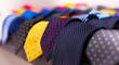 row of Neckties on hangers in men clothing store