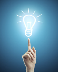 Leinwandbilder - Hand pointing to drawing lamp