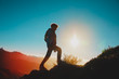 © nadezhda1906 - Silhouettes of young boy hiking at sunset mountains