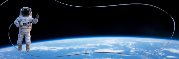 Wall Mural - astronaut in spacesuit performing a spacewalk above planet earth