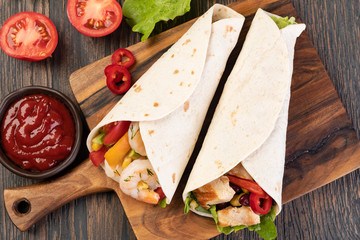 Canvas Print - burrito with vegetables and tortilla