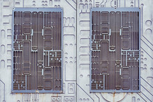 Metal Lattice In The Wall In The Form Of An Electronic Board. Technological Modern Background