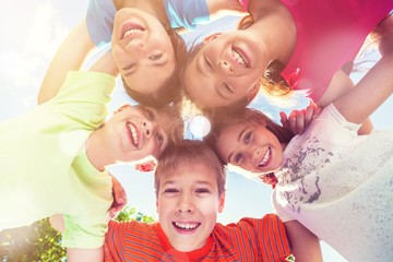 Group of children standing in circle and