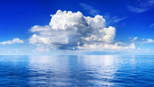 White Cumulus Clouds In Blue Sky Over Sea Landscape, Big Cloud Above Ocean Water Panorama, Horizon, Beautiful Tropical Sunny Summer Day Seascape Panoramic View, Cloudy Weather, Cloudscape, Copy Space