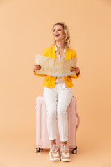 Wall Mural - Positive optimistic woman tourist holding map.