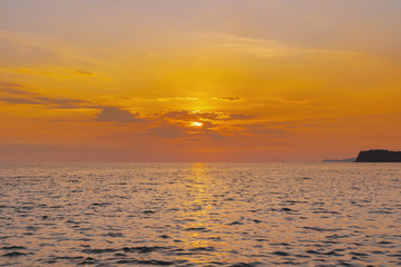 Wall Mural - landscape of sunset on the coast sea, waves, horizon. top view.