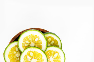 round slices of natural fresh yellow lemon on a white background